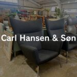 包み込む背と優雅な曲線が特徴。上質な張地と快適な座り心地で、空間に品格を与える名作ラウンジチェア。