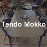 Tendo Mokko（天童木工）IMPALA（インパラ）ダイニングテーブル ダイニング用。成形合板の滑らかな曲線天板と細身脚が軽やかで、木目が光を柔らかく反射するミニマルデザイン。